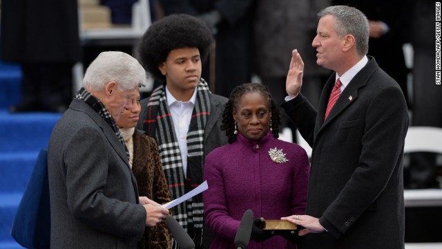 Bill de Blasio, right, is sworn in as New York City mayor by Clinton on the steps of City Hall in Lower Manhattan on January 1, 2014. With them are de Blasio's daughter Chiara, wife Chirlane and son Dante.