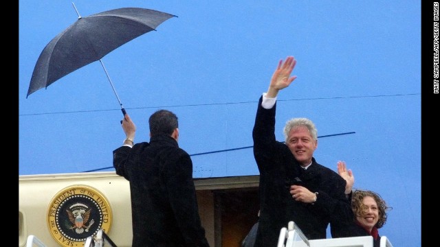 Clinton and daughter Chelsea wave before boarding his plane at Andrews Air Force Base as he leaves Washington following Bush's inauguration on January 20, 2001. Clinton was heading to his new home in Chappaqua, New York. 