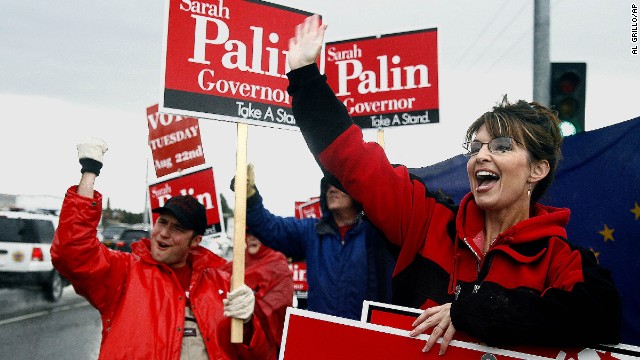 Palin stands in the rain in Anchorage in August 2006 as she campaigns for the Republican gubernatorial nomination. Palin defeated incumbent Frank Murkowski and former state legislator John Binkley win the race.