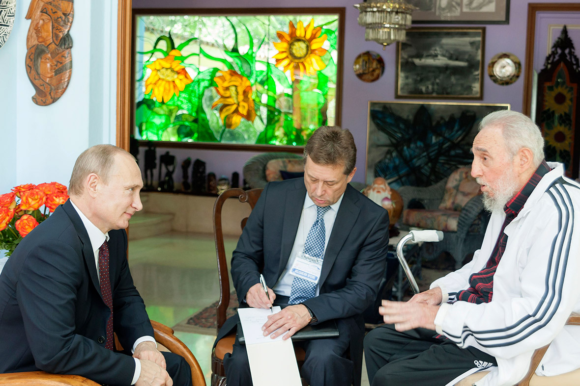 In an undated photograph released on 11 July 2014, Cuba's former president Fidel Castro talks with Russia's President Vladimir Putin during a meeting in Havana.