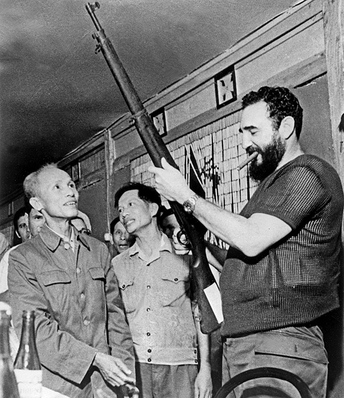 September 1973: Castro examines a rifle during a visit to North Vietnam during the Vietnam War.