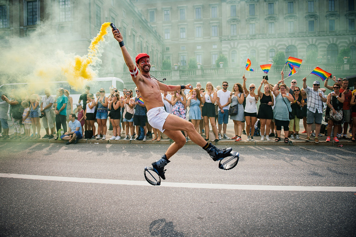 A reveller dances during the Gay Pride Parade in Stockholm