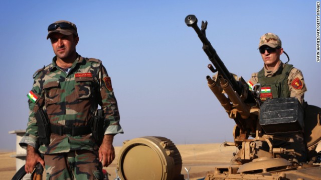 Kurdish Peshmerga fighters take position on the front line on August 8.