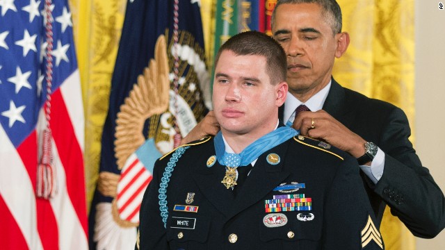 U.S. Army Sgt. Kyle White receives the Medal of Honor during a ceremony at the White House on Tuesday, May 13. He was recognized for repeatedly exposing himself to enemy fire in Afghanistan while trying to save the lives of fellow soldiers in November 2007. He is the 10th person to receive the military's highest honor for actions in Afghanistan.