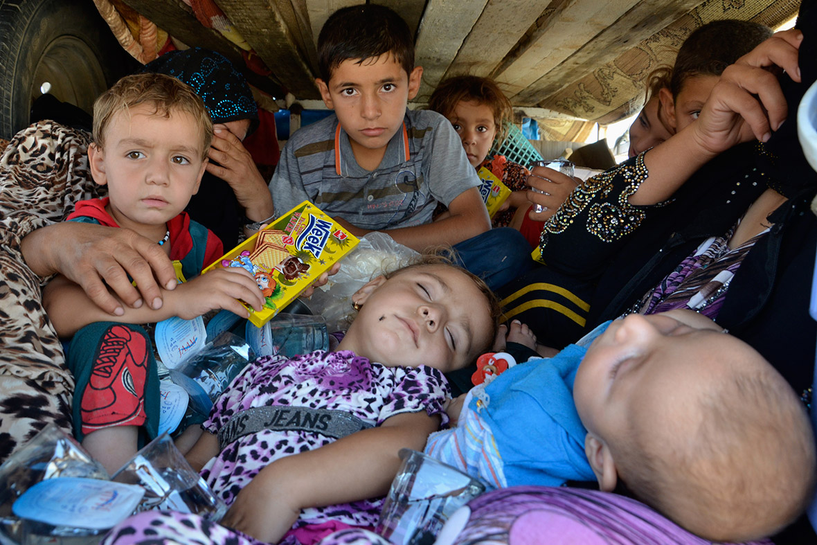 Children who fled from the violence in the province of Nineveh arrive in Sulaimaniya province, near the border with Iran.