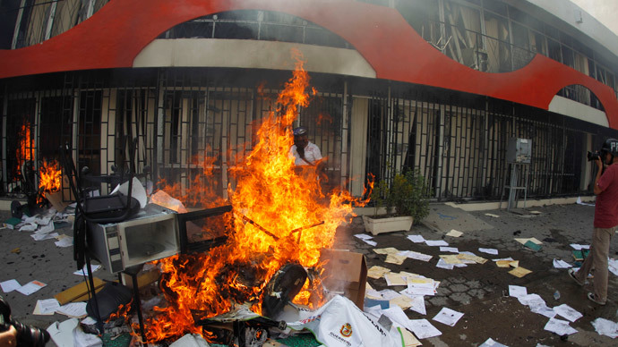 Furniture is set alight by members of CETEG (State Coordinator of Teachers of Guerrero teacher's union) outside the comptroller's office of the Secretary of the Department of Education in Guerrero, in Chilpancingo, November 12, 2014. (Reuters / Jorge Dan Lopez)
