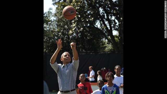 In addition to regularly playing golf, President Barack Obama also enjoys a game of basketball. Here he takes a shot during the Easter Egg Roll at the White House in April 2013.