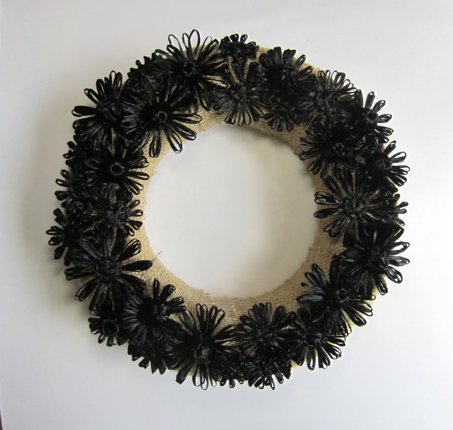 Delilah 12 inch burlap wreath with woven black flowers in vintage Swistraw by Ruby Buffalo.