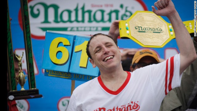 Joey Chestnut celebrates Friday, July 4, after winning the 98th annual Nathan's Famous Hot Dog Eating Contest at Coney Island in New York. Chestnut ate 61 hot dogs to win the men's competition for the eighth straight year.