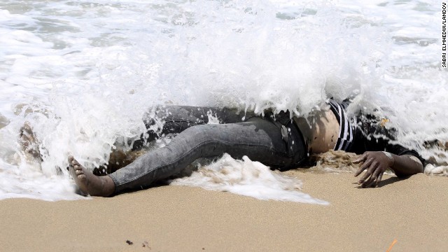 <strong>May 14:</strong> The body of an illegal migrant lies on the shore of al-Qarboli, Libya. Libyan officials said at least 40 people died and around 50 were rescued when <a href='http://ift.tt/1olFXK8'>a boat carrying mostly sub-Saharan migrants sank off the coast of Tripoli</a> on May 11.