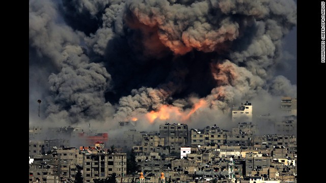 <strong>July 29:</strong> Smoke rises in Gaza City after Israeli airstrikes. Israel <a href='http://ift.tt/1nsyauc'>launched a ground operation in Gaza</a> after a 10-day campaign of airstrikes failed to halt relentless Hamas rocket fire on Israeli cities. After more than seven weeks of heavy fighting, Israel and Hamas agreed to an open-ended ceasefire that put off dealing with core long-term issues.