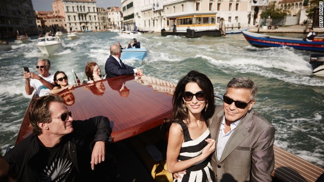 <strong>September 26:</strong> Actor George Clooney, right, and his fiancee, lawyer Amal Alamuddin, arrive in Venice, Italy, on Friday, September 26. The two were married that weekend in a private ceremony <a href='http://ift.tt/YrvVfX'>attended by some of their celebrity friends.</a> At left is Rande Gerber, husband of model Cindy Crawford.