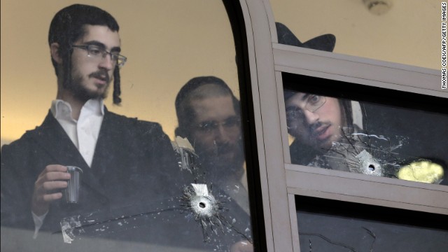 <strong>November 18:</strong> Men look at bullet holes on the main window of a Jerusalem synagogue that was attacked by two Palestinian men. <a href='http://ift.tt/1BJTmDj'>Four worshippers and a police officer were killed and several others were wounded</a> in the deadliest terror attack in Jerusalem since 2008.