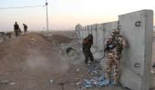 Atrincherados. Soldados kurdos se cubren de disparos de expresmistas islámicos (AP)