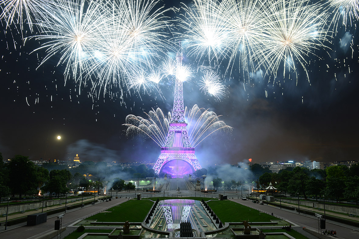 Fireworks explode around the Eiffel Tower in Paris during the annual Bastille Day celebrations.