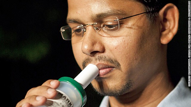 In 2011, Grand Challenges Canada and the Gates Foundation allocated $950,000 for research into a hand-held breathalyzer device to test for TB.<!-- --> </br>Pictured, Lead researcher Ranjan Nanda demonstrates the BIO-VOC, (funded through the Grand Challenges Canada's Co-Funded Phase II GCE program).