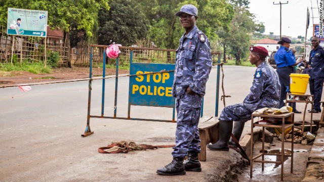 Police in Freetown, Sierra Leone, guard a roadblock Friday, September 19, as the country began enforcing a three-day nationwide lockdown.