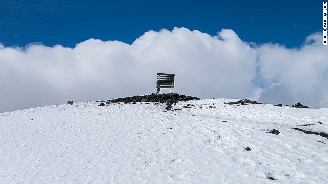 Alone on Uhuru Peak. Three corks from bottles of champagne were the only sign that somebody had been there earlier. 