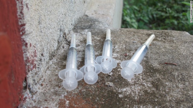 Syringes left after use in the graveyard. Hundreds -- if not thousands -- of empty syringe wrappers could be seen around crypts and tombs, as well as used syringes and glass vials.