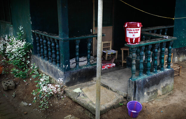 The home of Marthalene Williams, the Ebola-stricken woman aided by Thomas Eric Duncan. A man on the porch, who appeared to be in the late stages of Ebola, informed our photographer that he'd been to a hospital but was told to return home and quarantine himself.