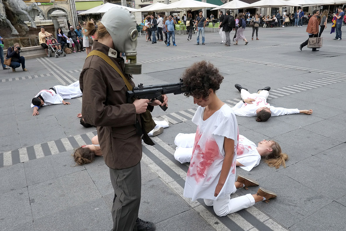 Performers take part in a protest action symbolising a forced and repressive election, organised by Syrian-born artist Rami Hassoun, in Lyon, France