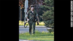 Police posted to social media a photograph of a man dressed in fatigues, carrying what appeared to be a rifle.