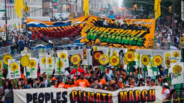 People gather near Columbus Circle before the People's Climate March in New York on Sunday, September 21. People from around the world are participating in what's billed as the largest march ever calling for action on global warming.