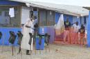 Boys stand in treatment area at the Bong County Ebola Treatment Unit in Liberia