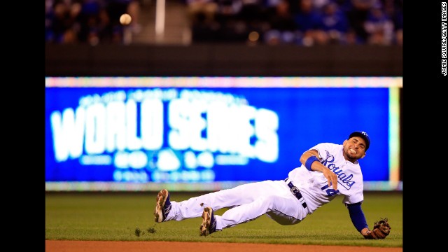 Kansas City Royals second baseman Omar Infante tries to make a play in the fourth inning against the San Francisco Giants during Game 7 of the 2014 World Series at Kauffman Stadium on October 29 in Kansas City, Missouri. 