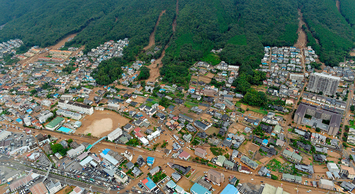 A month's worth of rain in one night triggered landslides that slammed into the outskirts of Hiroshima. Rain-sodden slopes collapsed in torrents of mud, rock and debris in least five valleys in the suburbs of the western Japanese city
