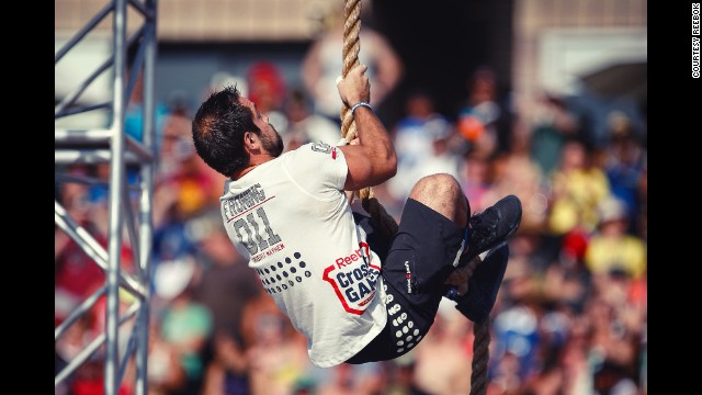 Froning does a rope climb during the <a href='http://ift.tt/15fS28m' target='_blank'>Thick N' Quick event</a>. Athletes had to do four rope climbs and three overhead squats with 165 pounds in under 4 minutes.