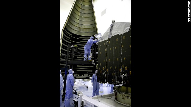 Workers in November get MAVEN ready to be placed inside the nosecone that will protect it during launch. NASA says the project will cost $671 million.