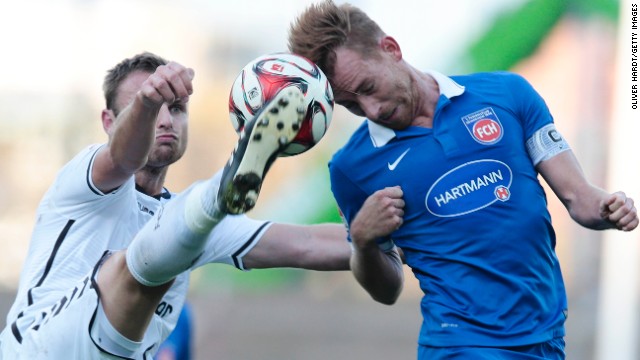 Bernd Nehrig of FC St. Pauli, left, and Marc Schnatterer of 1. FC Heidenheim compete for the ball during the Second Bundesliga match on Saturday, November 8, at Millerntor Stadium in Hamburg, Germany.