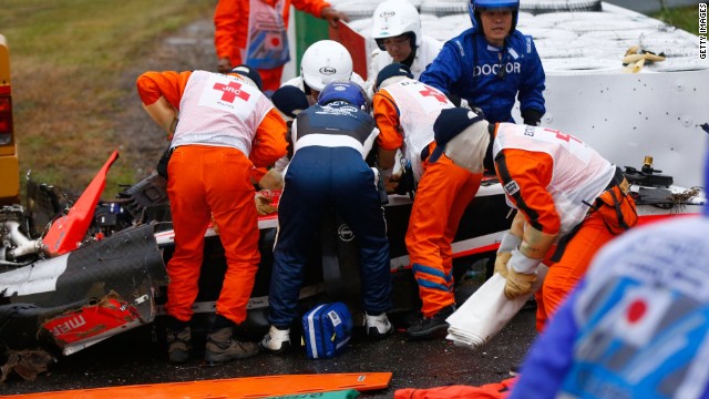 The Marussia driver receives urgent medical treatment after crashing during the Japanese Grand Prix at Suzuka.