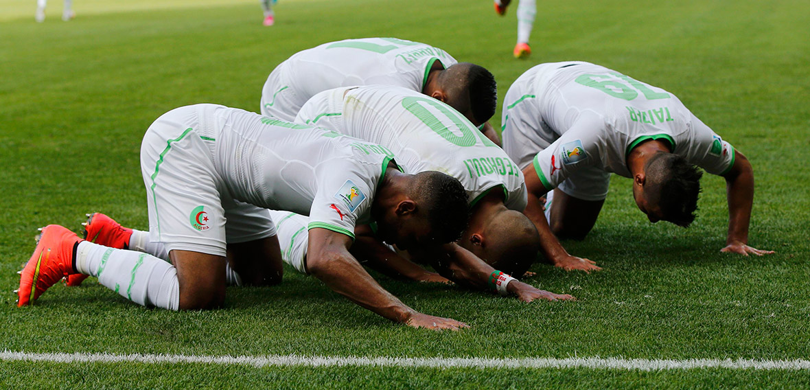 Algeria's Sofiane Feghouli celebrates with team-mates after scoring a goal during their 2014 World Cup Group H match against Belgium in Belo Horizonte on June 17, 2014