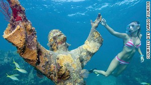 This statue of Christ literally supports marine life