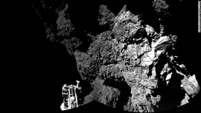 Rosetta's lander Philae is on the surface of Comet 67P/Churyumov-Gerasimenko on Thursday, November 13, and sending back images. One of the lander's three feet can be seen in the foreground. While Philae is the first probe to land on a comet, Rosetta is the first to rendezvous with a comet and follow it around the sun. The information collected by Philae at one location on the surface will complement that collected by the Rosetta orbiter for the entire comet.