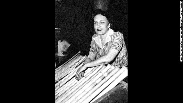 Negro League Newark Eagles baseball team owner Effa Manley poses with bats in the dugout in Ruppert Stadium in Newark, New Jersey, in 1948. Manley was the first woman elected and inducted to the Baseball Hall of Fame.