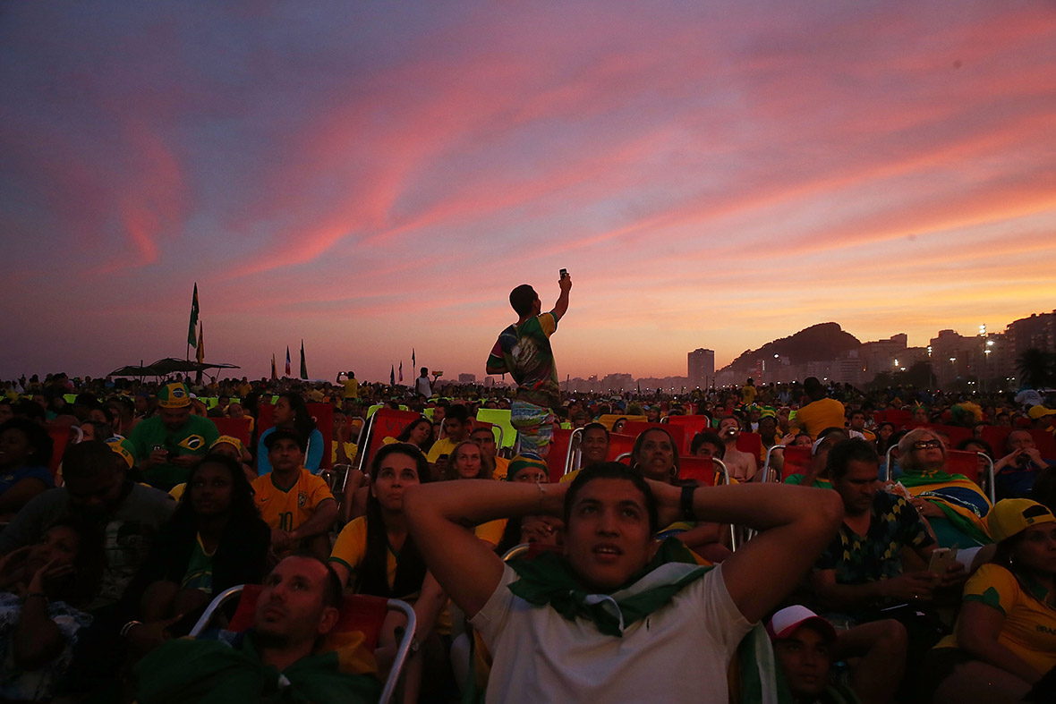 Brazil fans watch a live broadcast of the Brazil-Cameroon match at the Fifa Fan Fest on Copacabana Beach in Rio de Janeiro