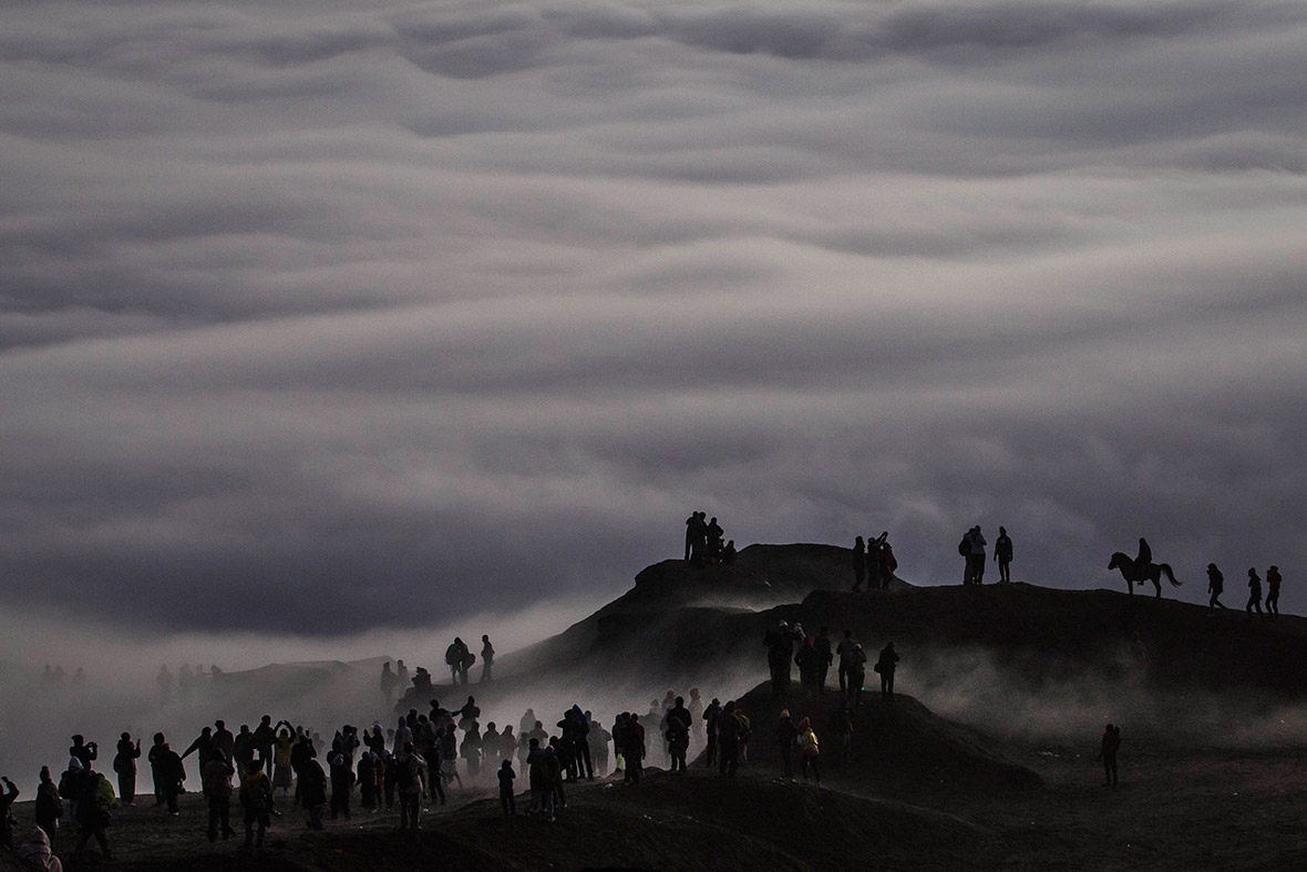 Tenggerese worshippers trek across the Sea of Sand to give their offerings to Mount Bromo