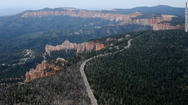 One of the most spectacular drives in the American West, Highway 12 in southern Utah passes two national parks, a national monument and a wide variety of scenery, including red-rock canyons and forested plateaus. This is an aerial view of Bryce Canyon National Park, famous for its rocky spires in pastel shades of red, pink and orange.