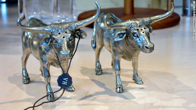 The Omni Dallas hotel Collections gift shop stocks an assortment of items crafted by Dallas artisans, including these pewter salt and pepper shakers shaped like longhorn steers.