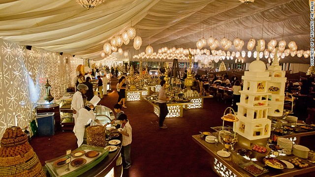 The white, billowy-walled Asateer Tent at the Atlantis Palm Jumeirah features a fountain from which sesame paste flows. 