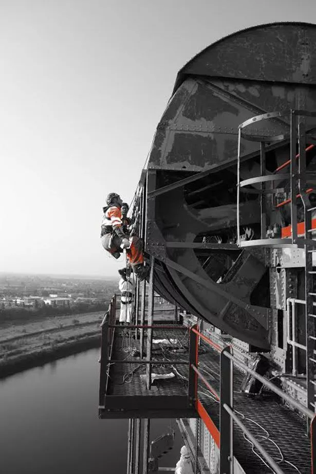 Workers repairing and repainting the Newport Bridge sent photos to Paul "Goffy" Gough to prove how hard they are working