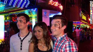 Cameron Johnson and his brother, Brad, accompanied by a Hangover Tour guide, on Soi Cowboy. 