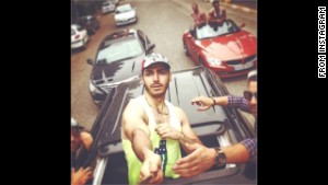 The photos show affluent young Iranians flaunting their wealth and Western lifestyle. In this one, young men cruise the streets in luxury cars.
