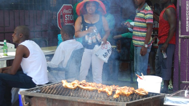 Oil drums cut in half lengthwise are frequently used as braais both at South African homes and at small restaurants, such as this one in Gugulethu in Cape Town. 