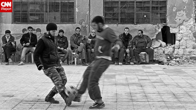 A group of Free Syrian Army fighters in Aleppo, Syria, takes a break for a <a href='http://ift.tt/1wIe80b'>quick game of pick-up soccer</a>. Photographer Reynaldo Leal captured the game while documenting the conflict in Syria in 2013.