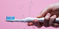 This Clever Electric Toothbrush Is Like a Bidet for Your Mouth