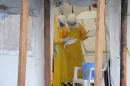 Health care workers wearing protective suits work at the Elwa hospital, where Ebola patients are treated, on August 30, 2014 in Monrovia, Liberia